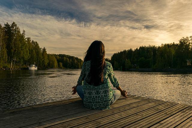 A person practicing mindfulness through yoga